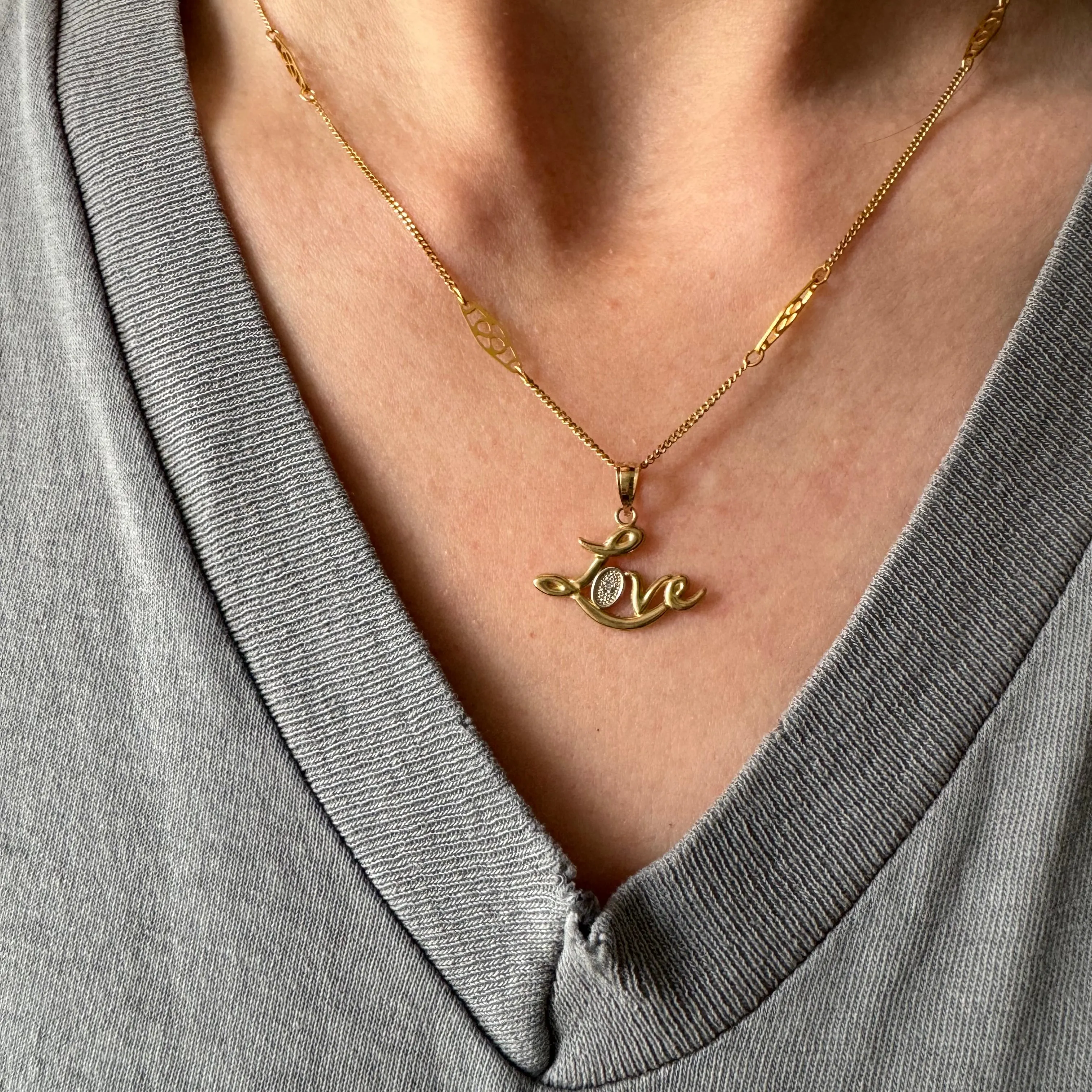 P R E - L O V E D // flowing LOVE / 10k yellow gold and tiny diamond love word / a pendant