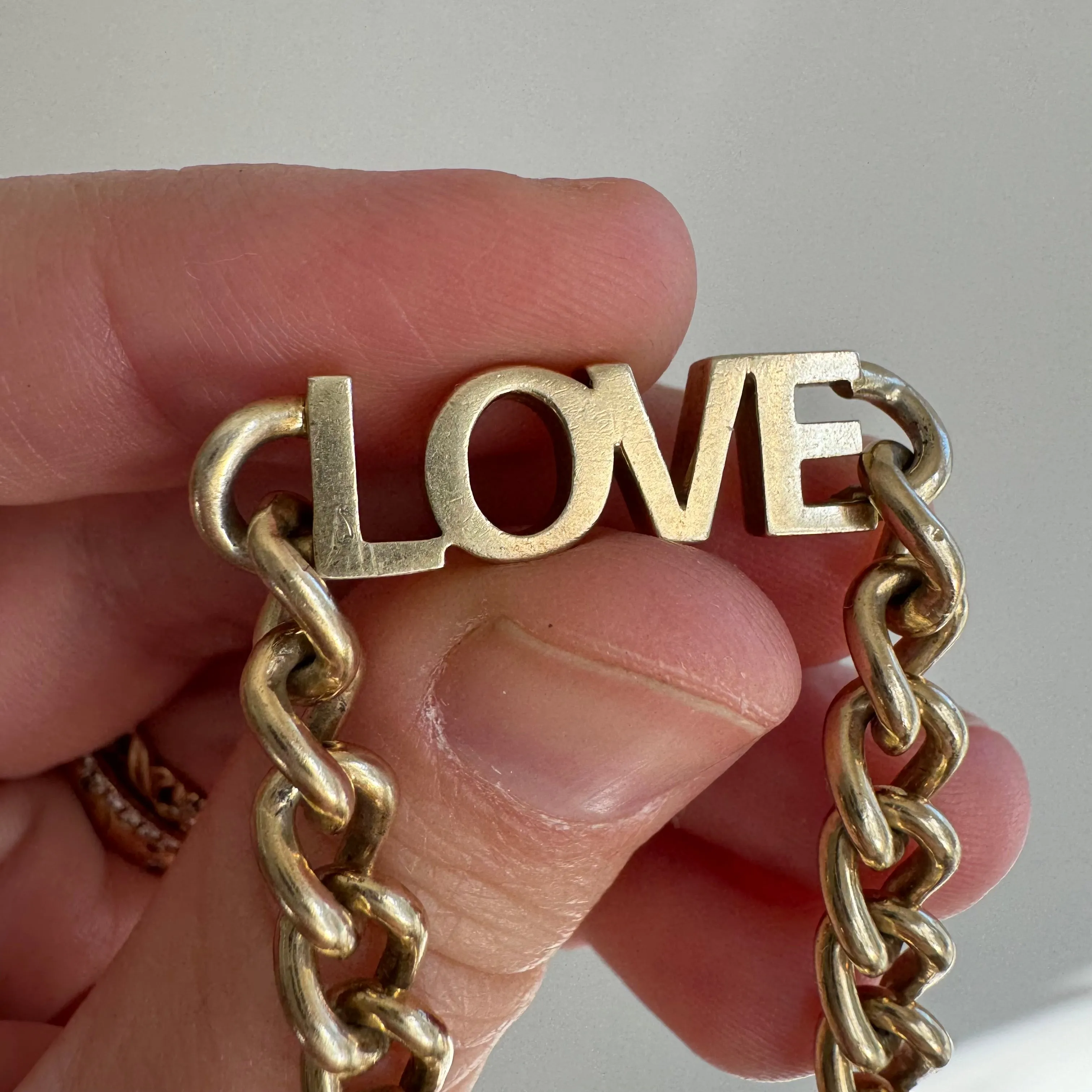 P R E - L O V E D // linked up LOVE / sterling silver and gold vermeil curb link LOVE bracelet / 7, 15g